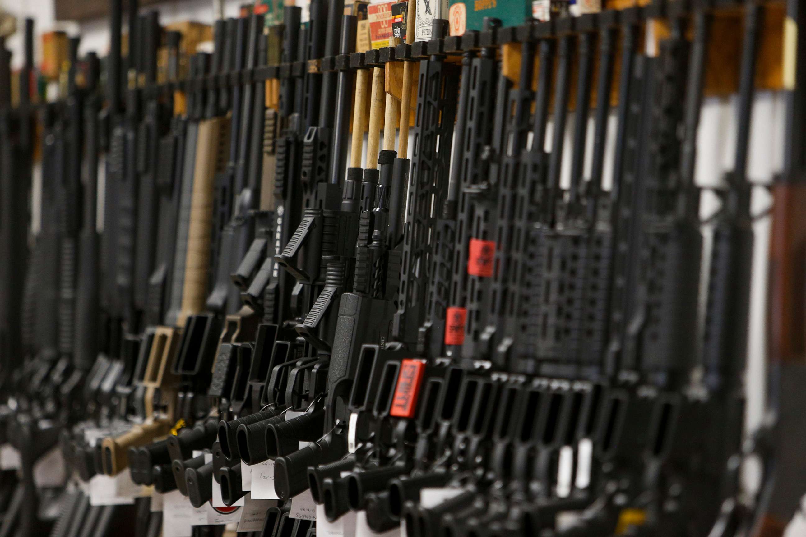 PHOTO: Rows of firearms for sale lean on the racks behind the counter at Tennessee Gun Country in Clarksville, Tenn., June 2, 2021.