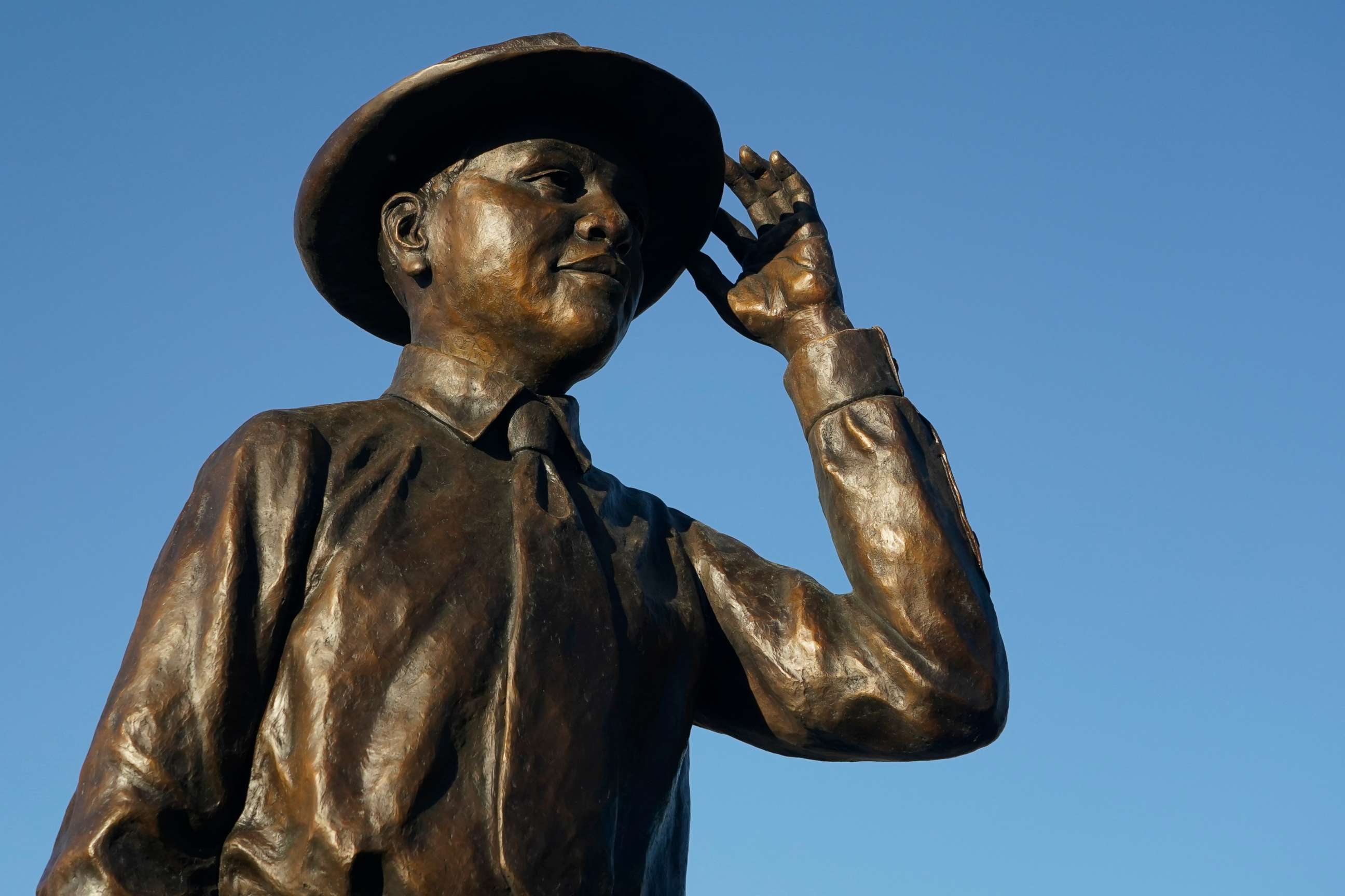 PHOTO: Emmett Till's statue reflects the afternoon sun, during its unveiling, Friday, Oct. 21, 2022 in Greenwood, Miss.  (AP Photo/Rogelio V. Solis)