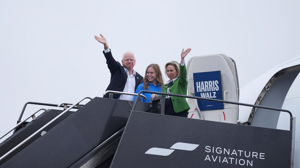 PHOTO: Democratic vice presidential nominee Minnesota Gov. Tim Walz, daughter Hope Walz and wife Gwen Walz wave to supporters before departing from Minneapolis-St. Paul airport, Nov. 4, 2024, in Minneapolis. 