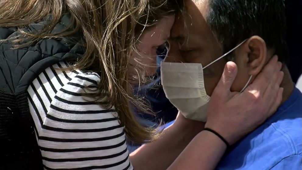 PHOTO: Amanda Phommachanh reunites with her husband, Titou Phommachanh, after he spent three weeks in the hospital due to the novel coronavirus. 