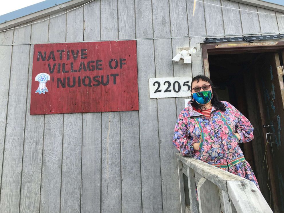 PHOTO: Nuiqsut Tribal Administrator Martha Itta wears a face mask in front her tribal village offices.