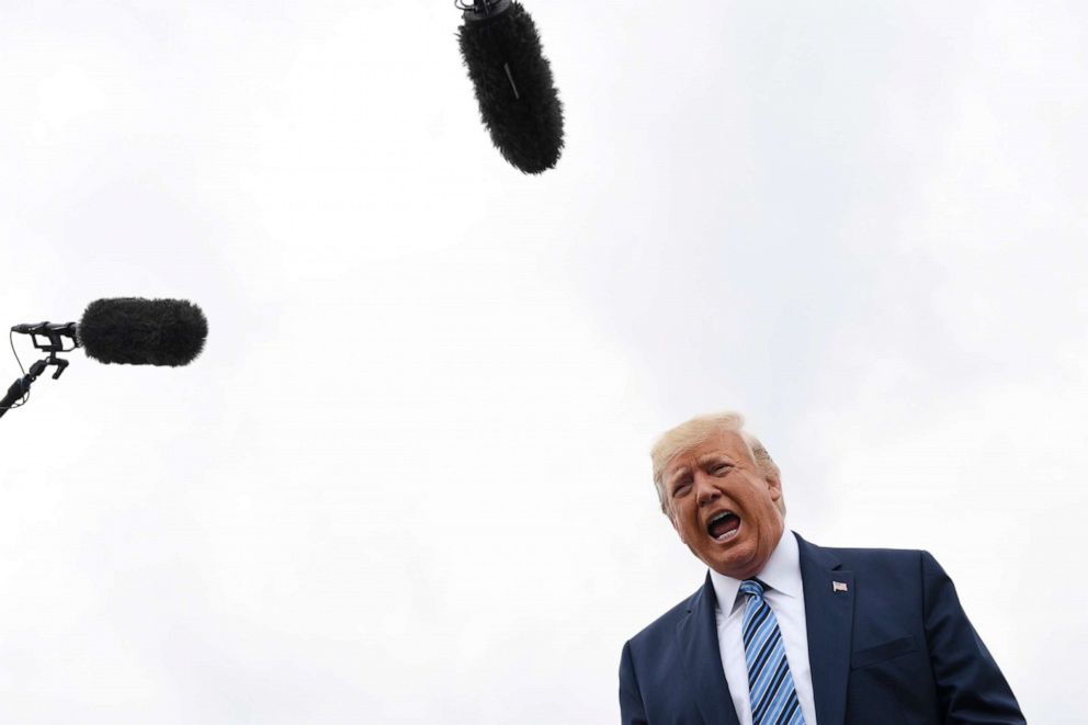 PHOTO: President Donald Trump talks to the media before boarding Air Force One at Morristown Municipal Airport in Morristown, N.J., Aug. 13, 2019. 