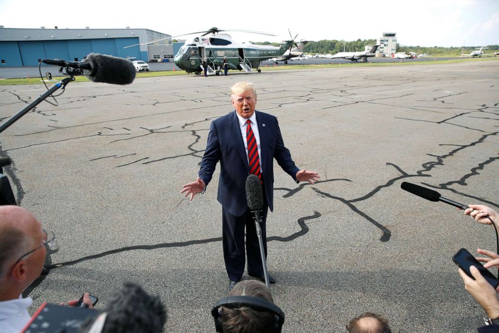 PHOTO: President Donald Trump speaks with reporters before boarding Air Force One at Morristown Municipal Airport in Morristown, N.J., Aug. 18, 2019.