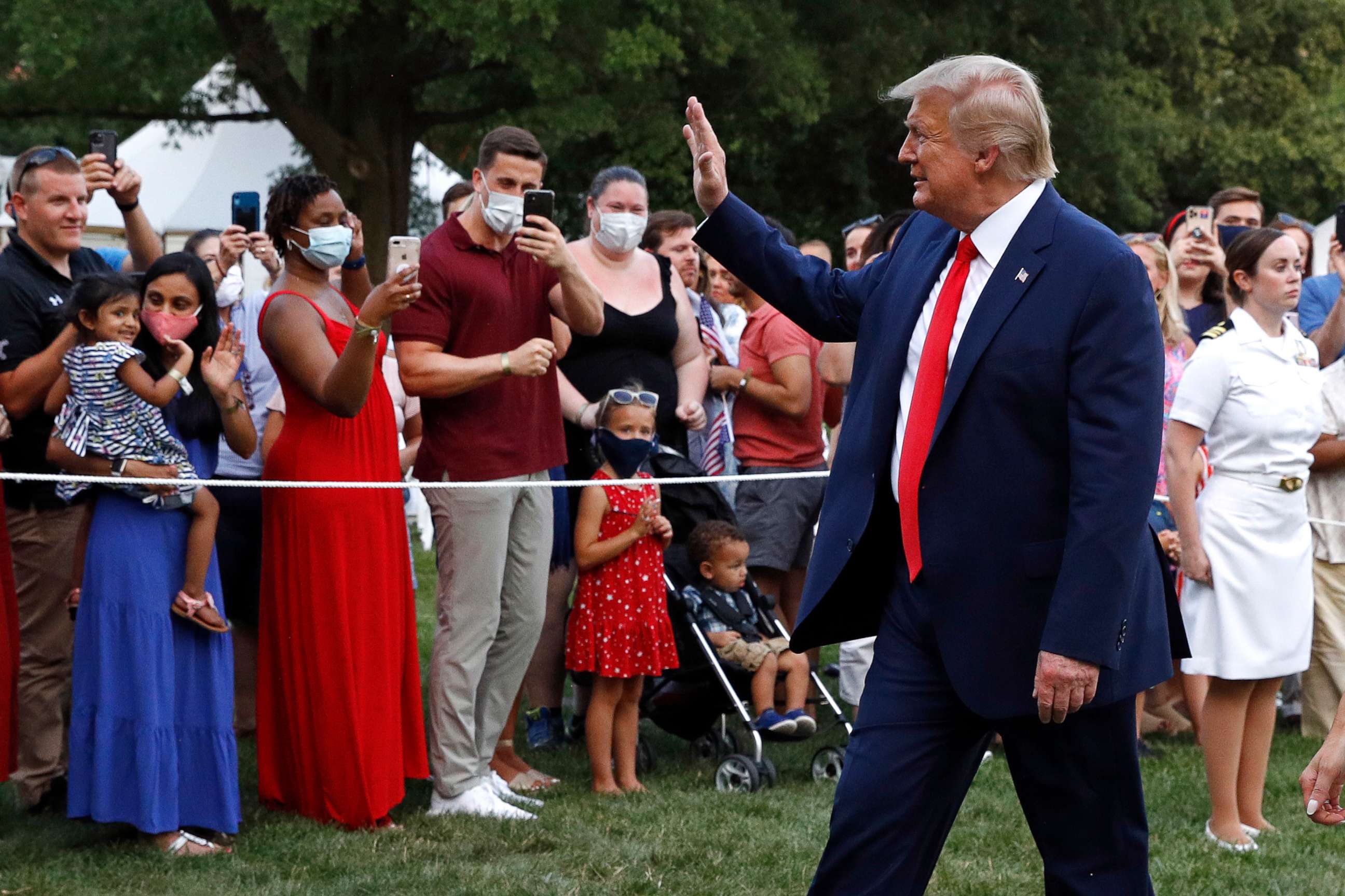 PHOTO: President Donald Trump greets visitors as he walks on the South Lawn of the White House during a "Salute to America" event, Saturday, July 4, 2020, in Washington.