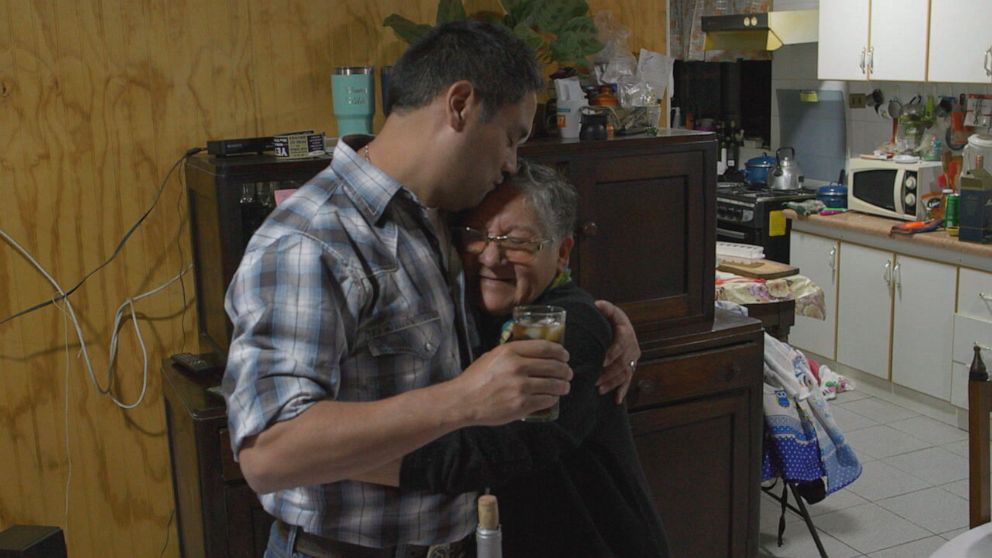 PHOTO: Tyler Graf hugs his biological mom Hilda Quezada Godoy in her home in Chile.