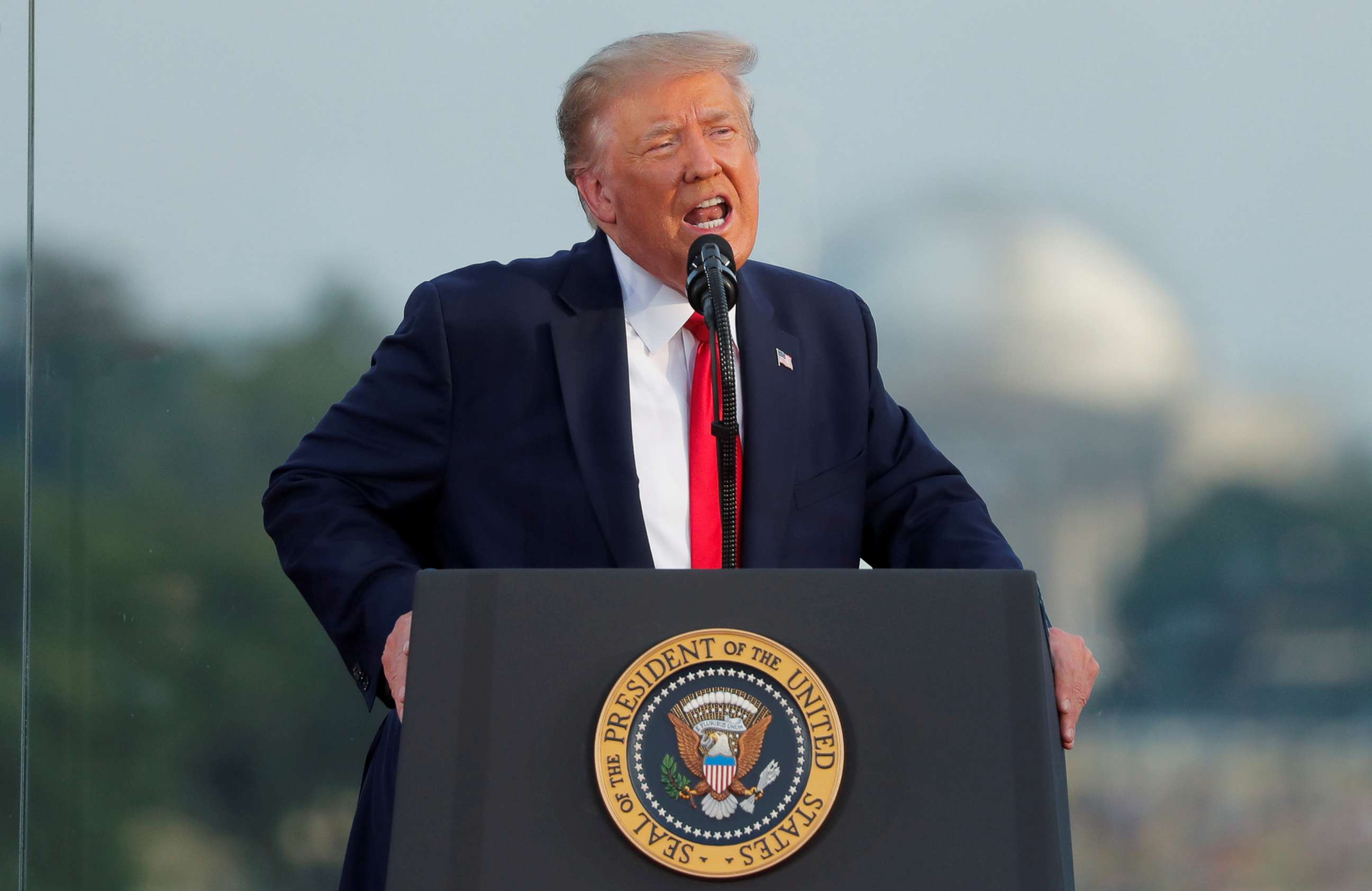 PHOTO: U.S. President Donald Trump speaks to attendees as he hosts a 4th of July "2020 Salute to America" to celebrate the U.S. Independence Day holiday at the White House in Washington, U.S., July 4, 2020.   