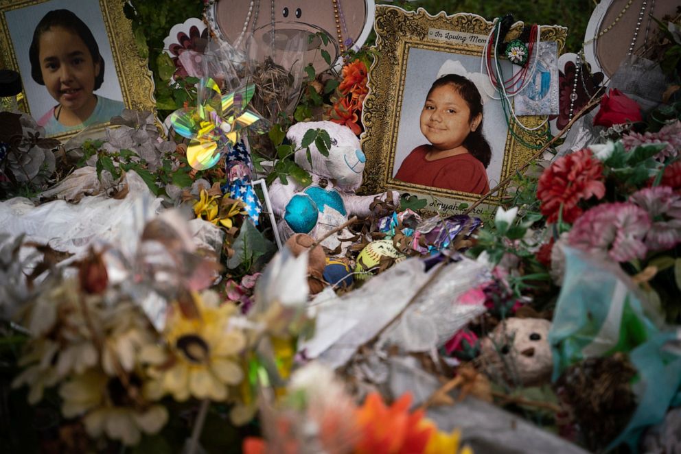 PHOTO: Photographs of Alithia Haven Ramirez, 10, left, and Eliahna "Ellie" Amyah Garcia, 9, who were killed in a mass shooting on May 24, 2022, are memorialized outside of Robb Elementary School in Uvalde, Texas on Nov. 18, 2022.