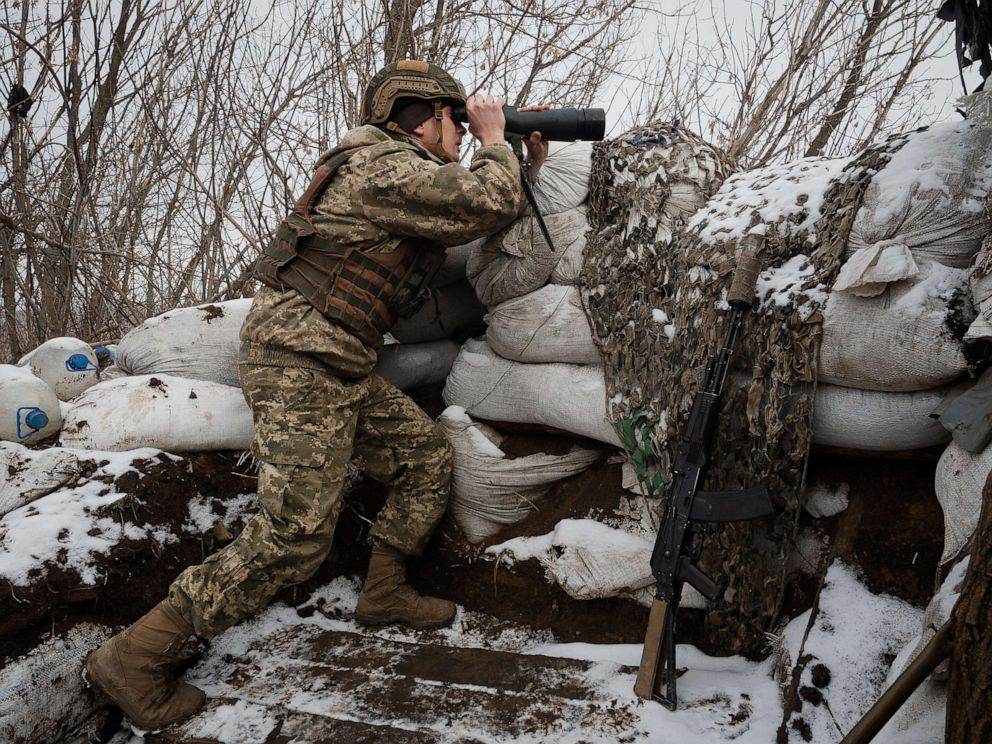 PHOTO: A Ukrainian Serviceman monitors the possible movement of the separatist forces at a frontline position held by Ukraine's 503rd Detached Marine Battalion on Feb. 7, 2022, near Verkhnotoretske, Ukraine. 