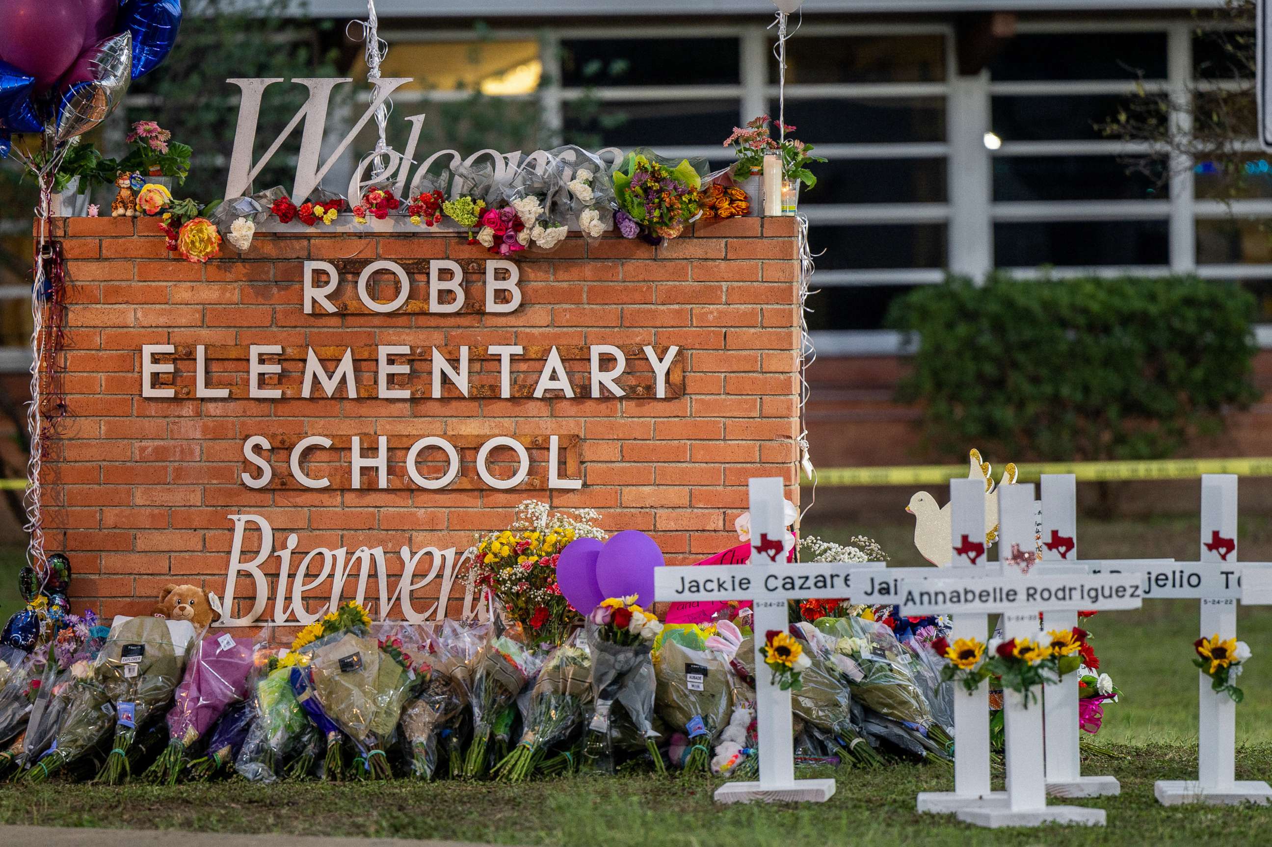 PHOTO: A memorial is seen surrounding the Robb Elementary School sign following the mass shooting at Robb Elementary School, May 26, 2022, in Uvalde, Texas. 