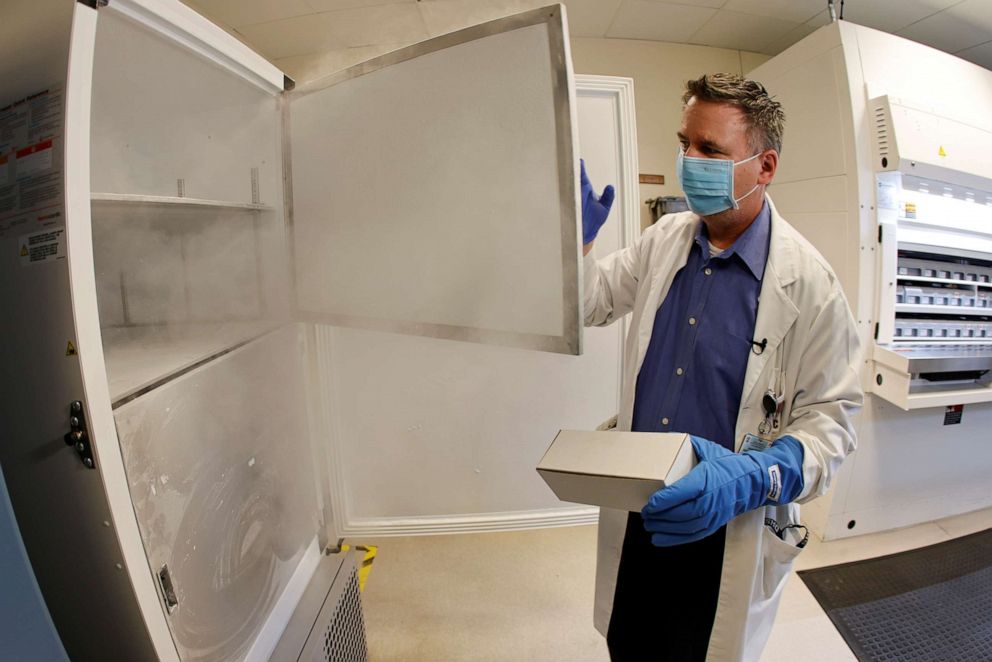 PHOTO: Pharmacy supervisor Kevin Weissman opens the door of a special freezer that will hold the Pfizer vaccine at LAC USC Medical Center during the outbreak of the coronavirus disease (COVID-19) in Los Angeles, California, U.S., December 10, 2020.  