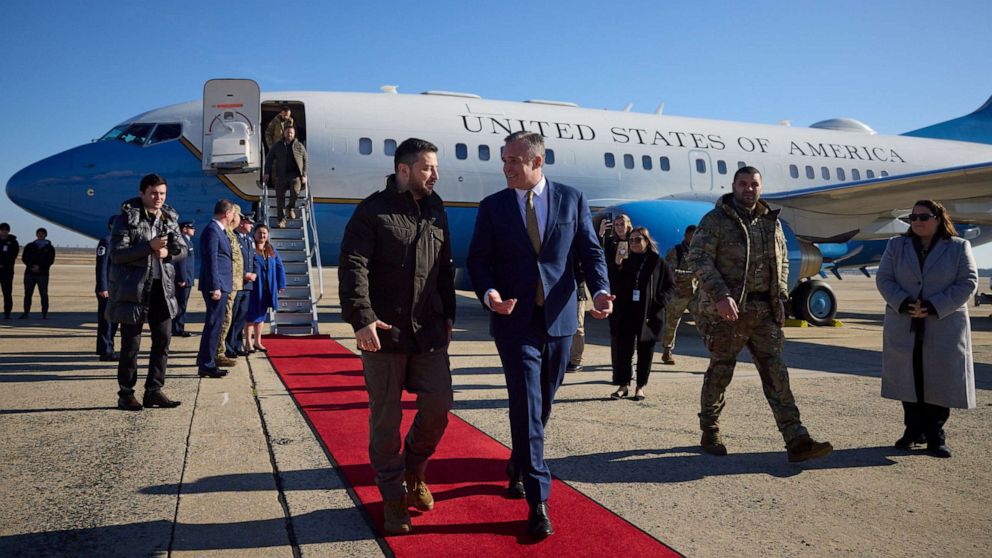 PHOTO: Ukraine's President Volodymyr Zelenskyy walks with Chief of Protocol of the United States Rufus Gifford as he arrives, Dec. 21, 2022, in Washington.