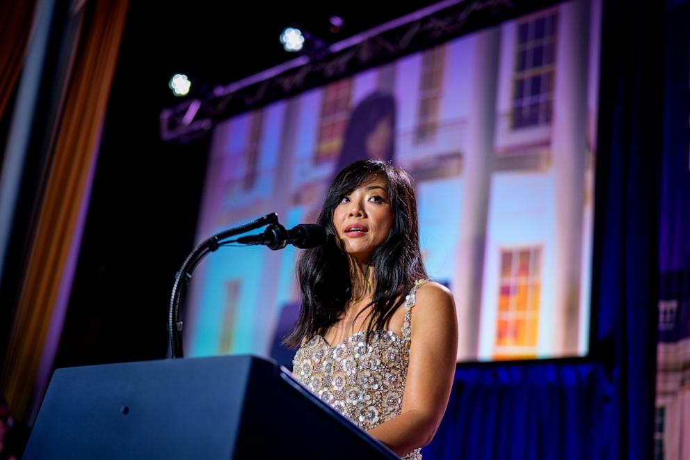 PHOTO: White House Correspondents Association President Weijia Jiang comes back to the stage to speak after a shooting incident at the annual White House Correspondents Association Dinner April 25, 2026, in Washington, D.C.