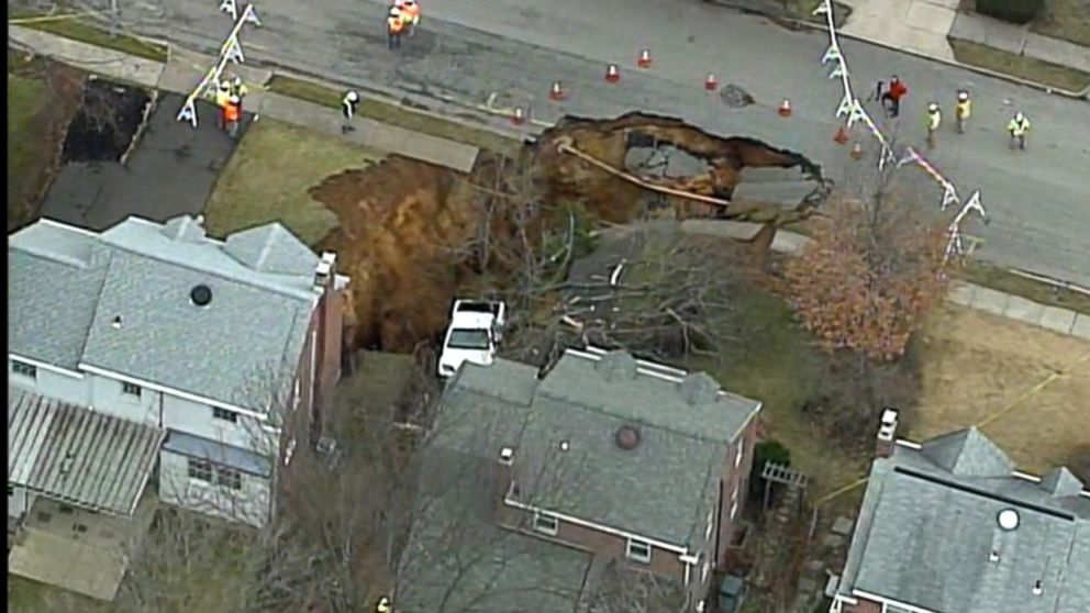 PHOTO:  A large sinkhole opened up in Cheltenham Township, Pennsylvania, early in the morning on Wednesday, Jan. 25, 2017. 