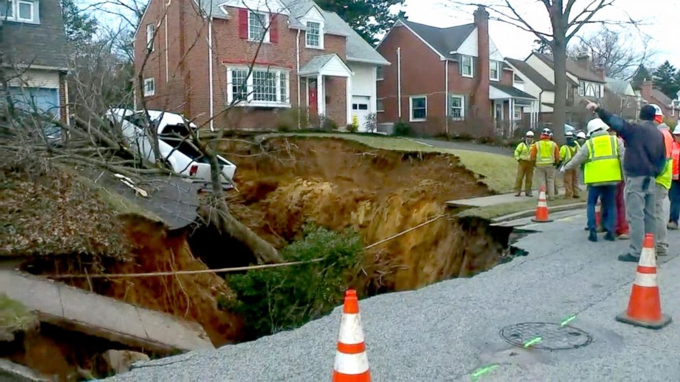 PHOTO:  A large sinkhole opened up in Cheltenham Township, Pennsylvania, early in the morning on Wednesday, Jan. 25, 2017. 