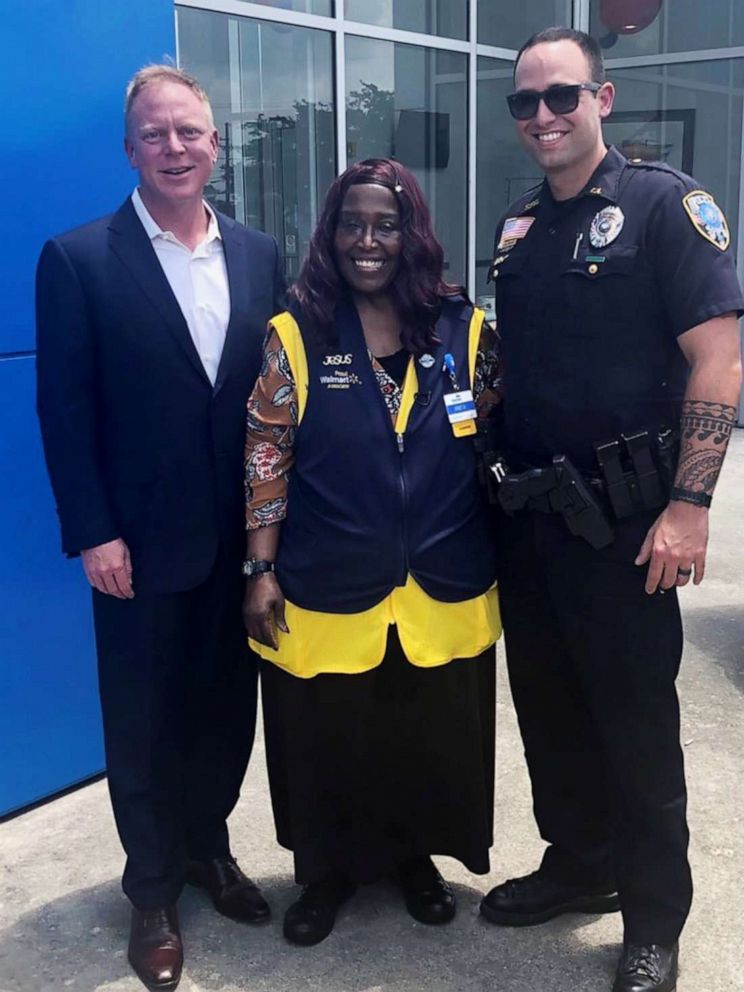 PHOTO: Chevrolet dealership owner Matt Bowers, Walmart cashier Anita Singleton and Slidell Police officer Brad Peck are pictured after Singleton, who would walk six miles to work, was presented with a new car on May 22, 2019.