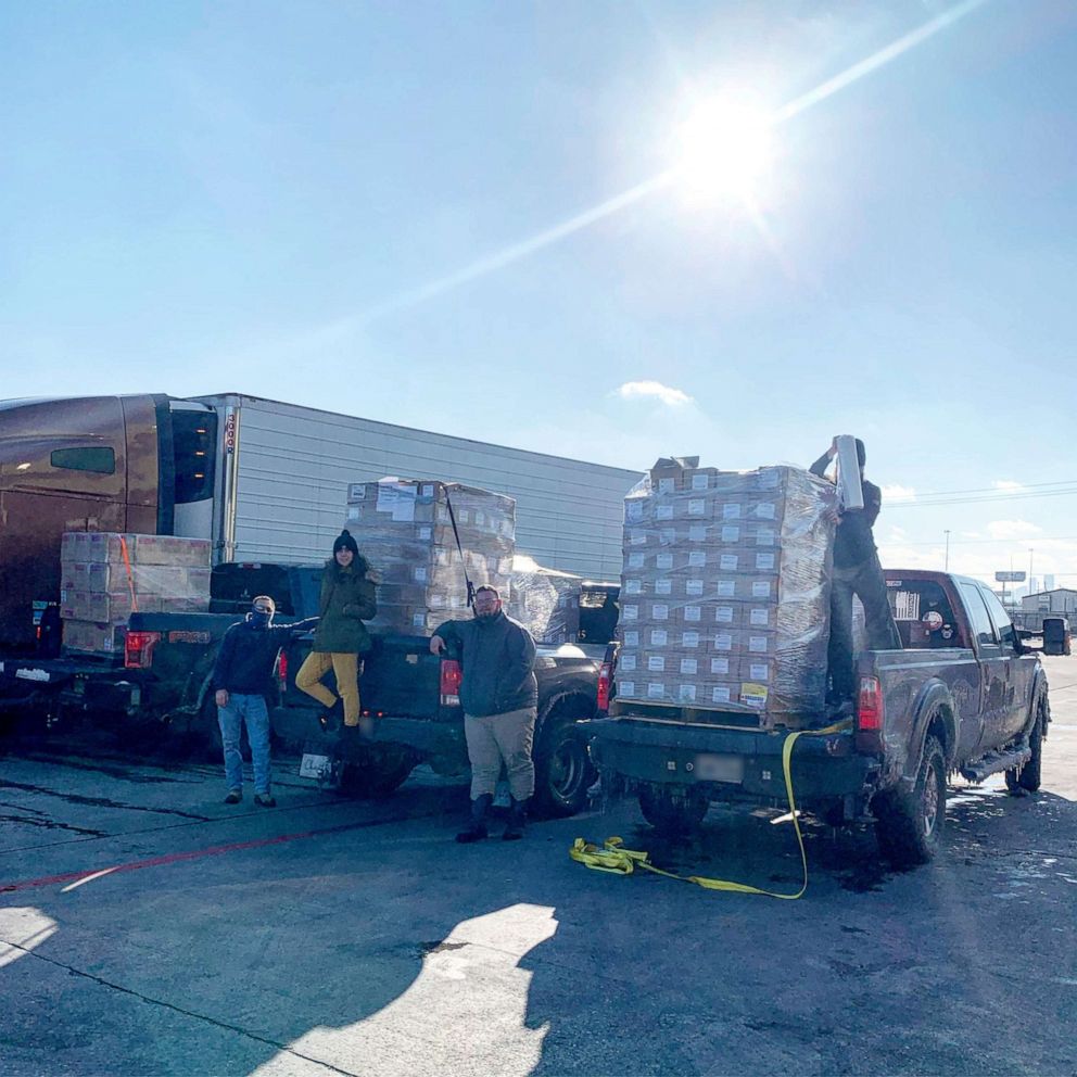 PHOTO: Derrick Pittman, Cara Adams, Zeke Presley and Ray Villarreal at the Houston Food Bank picking up food to go to the George R. Brown Convention Center in Houston.