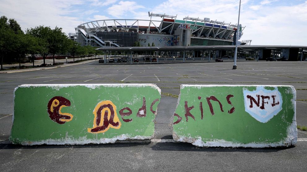 PHOTO: LANDOVER, MARYLAND - JULY 13: Hand painted concrete barriers stand in the parking lot of FedEx Field, home of the NFL's Washington Redskins team July 13, 2020 in Landover, Maryland. 