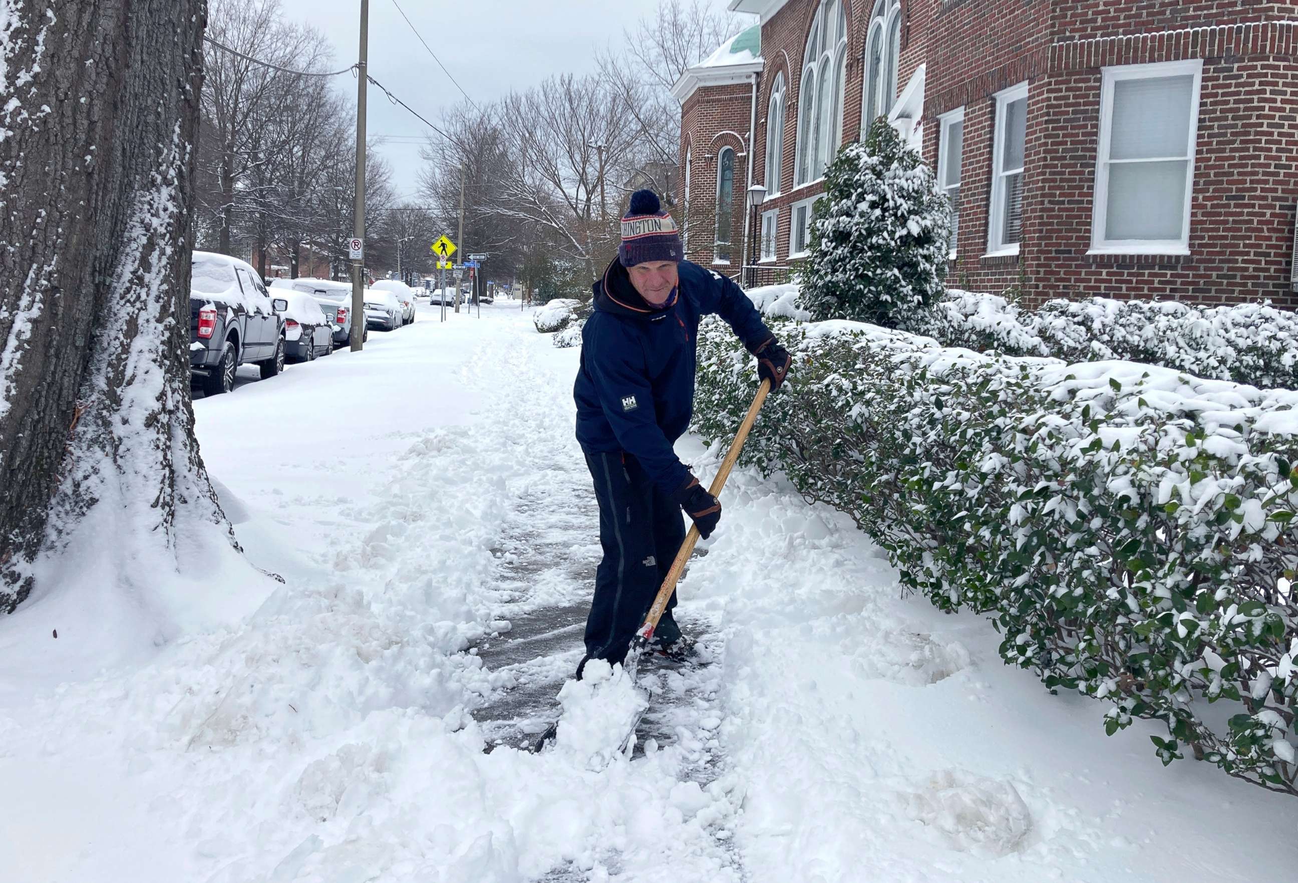 PHOTO: Richard Fuller, 45, shovels a sidewalk in Norfolk, Va., Jan. 22, 2022. 