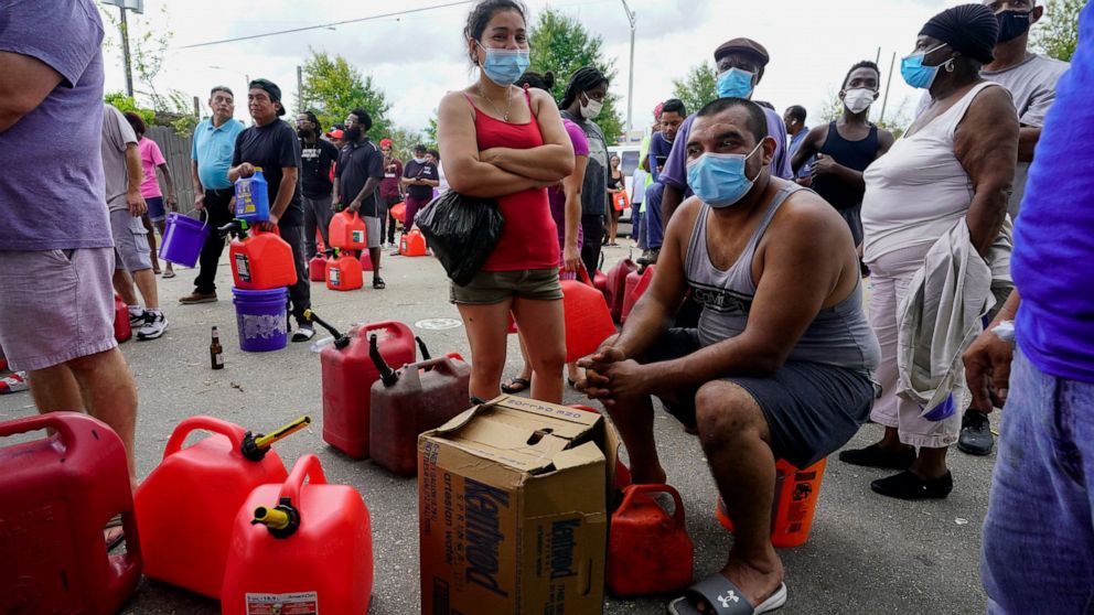 In the aftermath of Hurricane Ida, people wait in line for gas Tuesday, Aug. 31, 2021, in New Orleans, La. (AP Photo/Eric Gay)