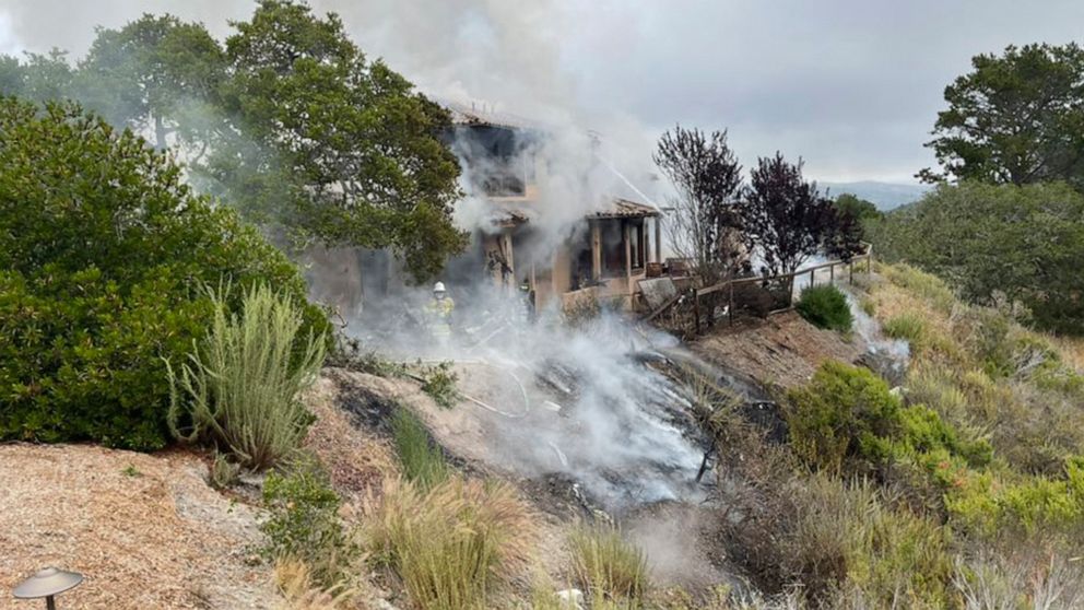 In this photo provided by the Monterey County Regional Fire District is the scene where a plane crashed into a home near Highway 68 in Monterey County, Calif., on Tuesday, July 13, 2021. A small plane crashed into a home starting a fire in the house 