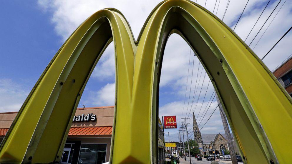 FILE - This April 30, 2019, file photo, shows a McDonald's restaurant on the Northside of Pittsburgh. U.S. restaurants and stores are rapidly raising pay in an urgent effort to attract more applicants and keep up with a flood of customers as the pand