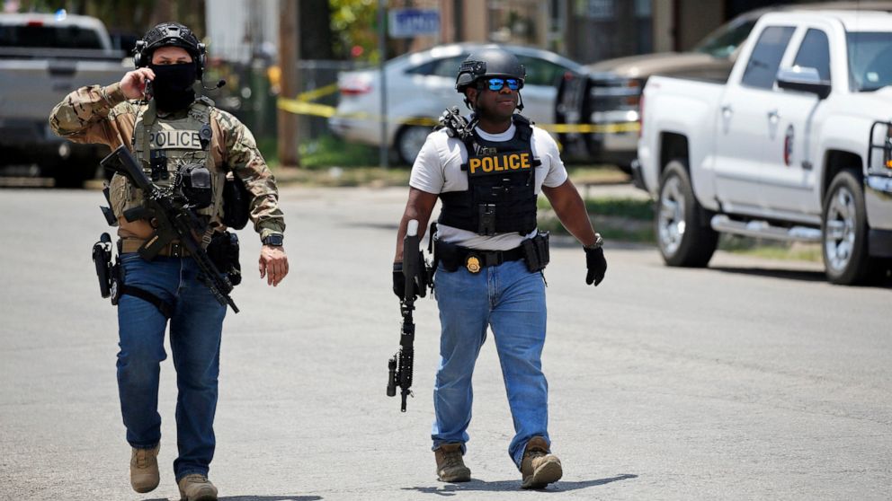 Police walk near Robb Elementary School following a shooting, Tuesday, May 24, 2022, in Uvalde, Texas. (AP Photo/Dario Lopez-Mills)