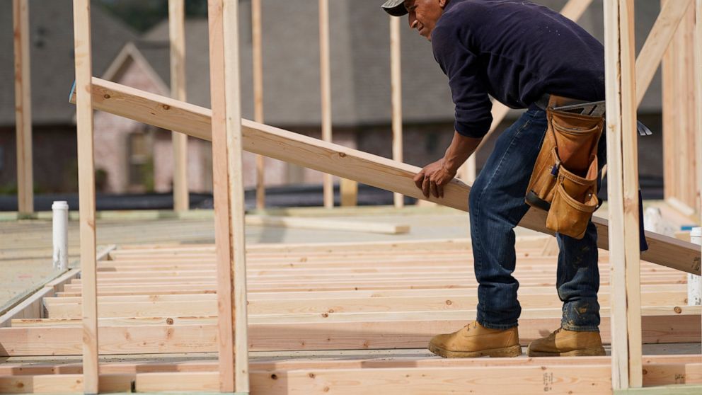 A carpenter aligns a beam for a wall frame at a new house site in Madison County, Miss., Tuesday, March 16, 2021. U.S. home construction fell by a bigger-than-expected amount in April but the drop came after housing had risen to the highest level in 