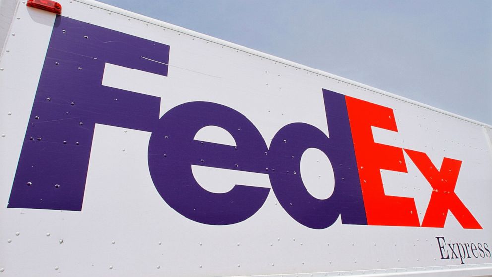 FILE - The FedEx logo is seen on a delivery truck, Tuesday, June 21, 2011, in Springfield, Ill. On Monday, Oct. 17, 2022, a federal judge dismissed FedEx from a lawsuit filed by relatives of five of the eight people who were fatally shot last year at