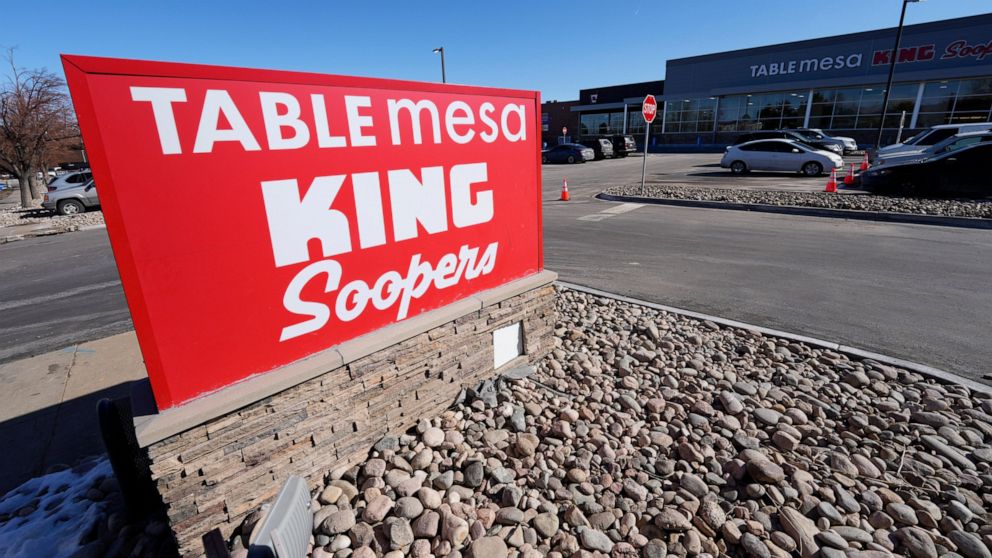 The new sign is displayed outside the Table Mesa King Soopers during a media tour Tuesday, Feb. 8, 2022, in Boulder, Colo. Ten people were killed inside and outside the store when a gunman opened fire on March 22, 2021. The store reopens with new ren