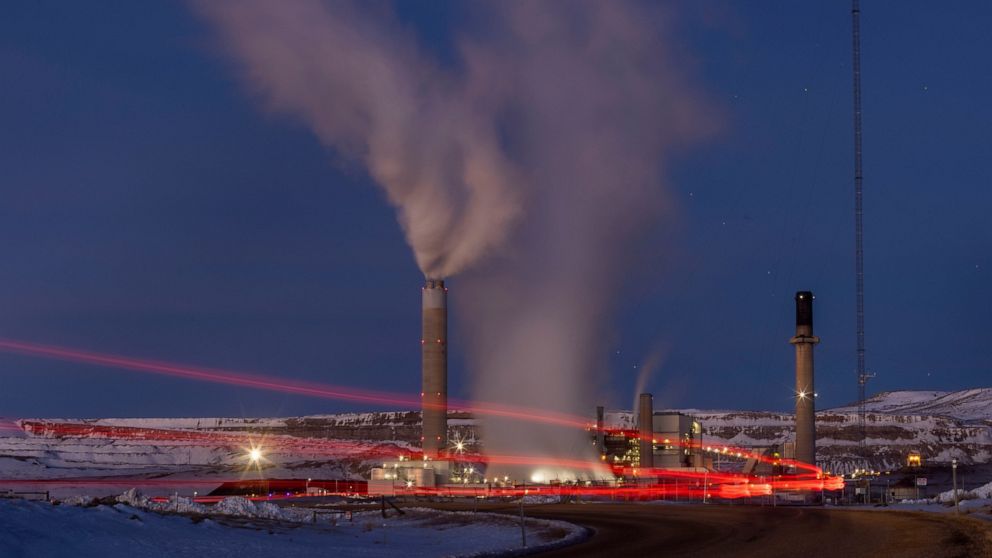 FILE - In this photo taken with a slow shutter speed, taillights trace the path of a motor vehicle at the Naughton Power Plant, Thursday, Jan. 13, 2022, in Kemmerer, Wyo. While the power plant will be closed in 2025, Bill Gates' company TerraPower an
