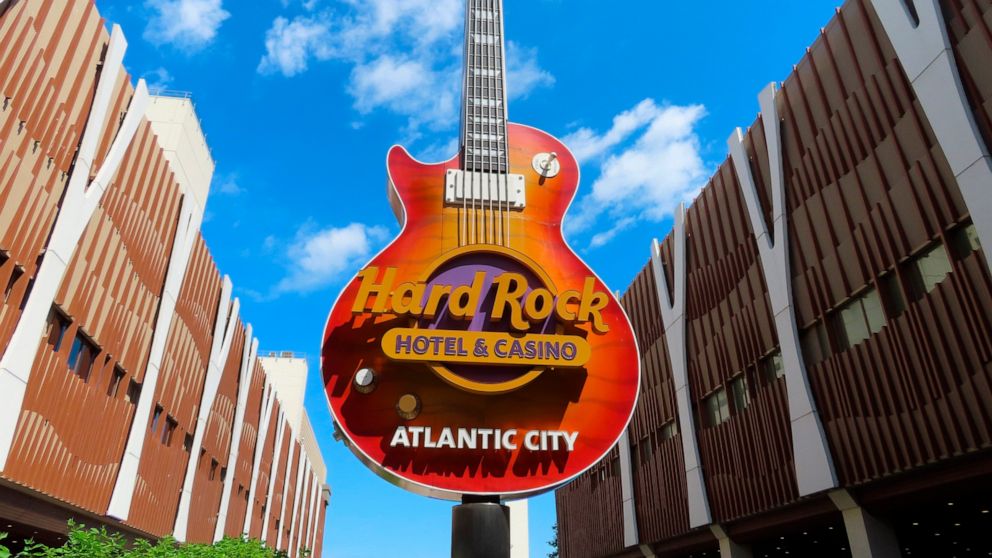 Clouds pass behind the guitar sculpture at the entrance to the Hard Rock casino in Atlantic City, N.J., on June 28, 2022. On Saturday, July 2, 2022, Hard Rock reached agreement with Atlantic City's main casino workers union, ending the last possibili