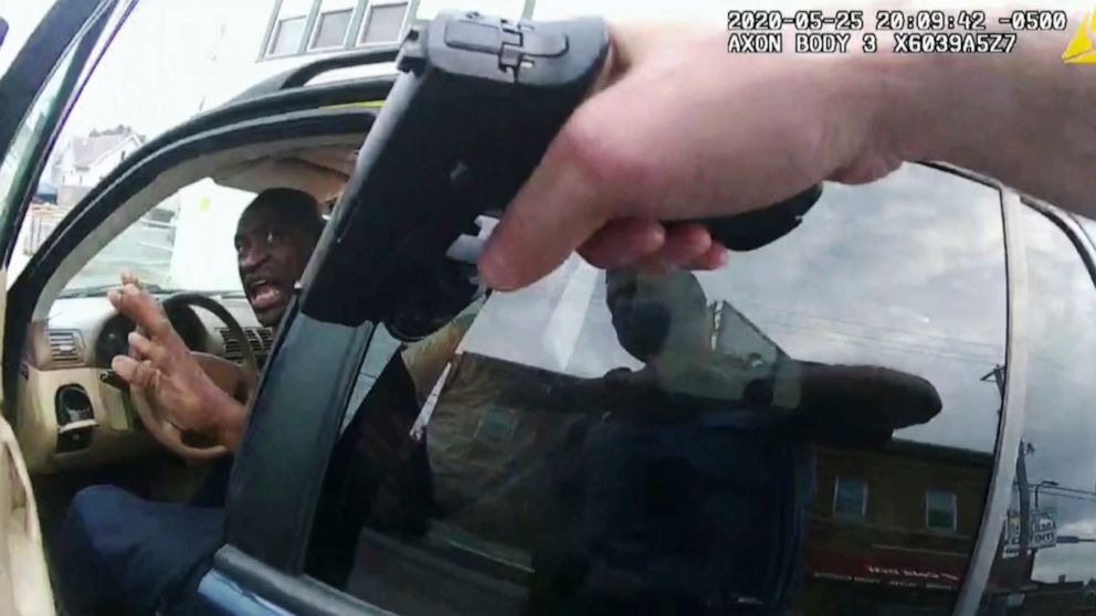 FILE - In this April 19, 2021 file image from police body camera video George Floyd responds to police after they approached his car outside Cup Foods in Minneapolis, on May 25, 2020. The image was shown as prosecutor Steve Schleicher gave closing ar
