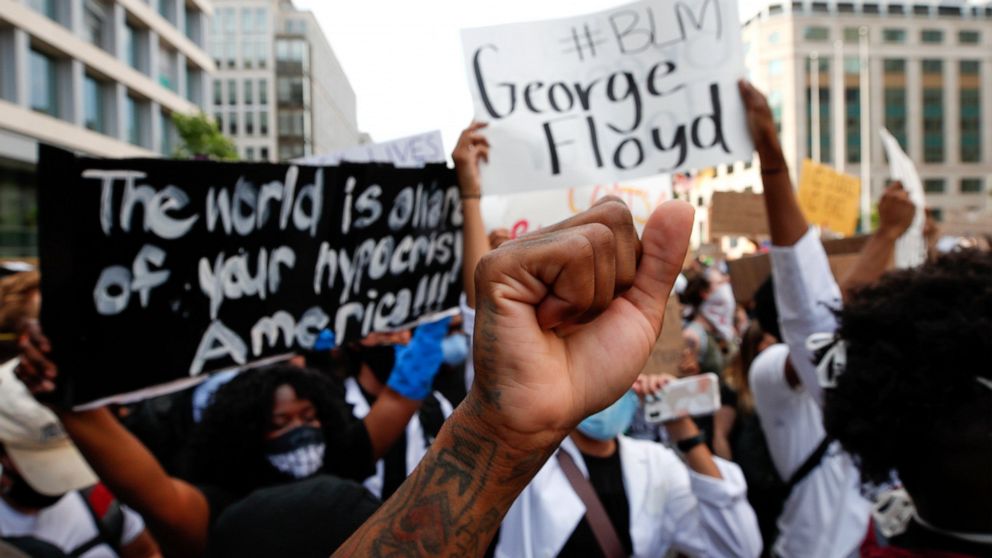 FILE - In this June 3, 2020, file photo, demonstrators gather near the White House in Washington to protest the death of George Floyd. A report released Thursday, July 15, 2021, says more than 90% of donors who supported racial equity initiatives in 