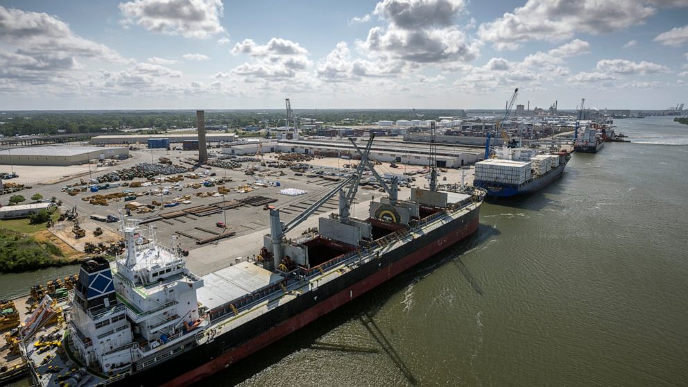 In this photo provided by the Georgia Ports Authority, three vessels work to load and unload cargo at the Georgia Ports Authority Ocean Terminal, June 24, 2022 in Savannah, Ga. On Monday, Dec. 5, 2022 the Georgia Ports Authority announced it will sta