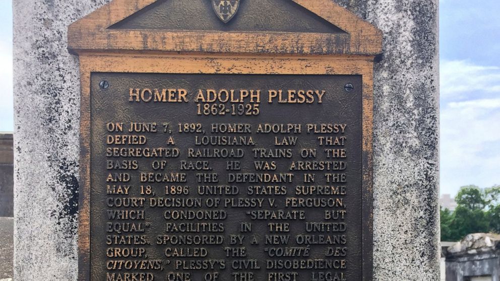 FILE - This June 3, 2018 photo shows a marker on the burial site for Homer Plessy at St. Louis No. 1 Cemetery in New Orleans. Homer Plessy, the namesake of the U.S. Supreme Court’s 1896 “separate but equal” ruling, is being considered for a posthumou