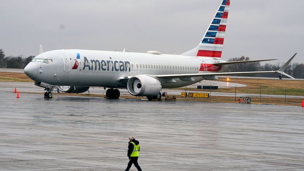 FILE - An American Airlines Boeing 737 Max jet plane is parked at a maintenance facility in Tulsa, Okla., Wednesday, Dec. 2, 2020. A former Boeing test pilot pleaded not guilty Friday, Oct. 15, 2021, to charges that he deceived regulators by withhold