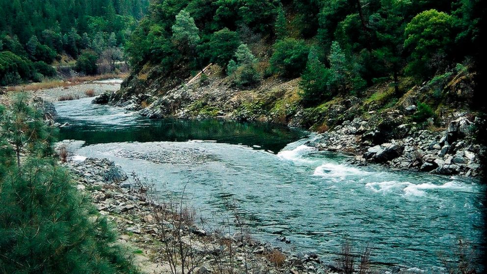 FILE - The Trinity River flows below the Lewiston Dam outside Lewiston, Calif., on March 12, 2003. On Monday Oct. 31, 2022, the Hoopa Valley Tribe sued the Biden Administration, alleging the federal government is violating the tribe's sovereignty and
