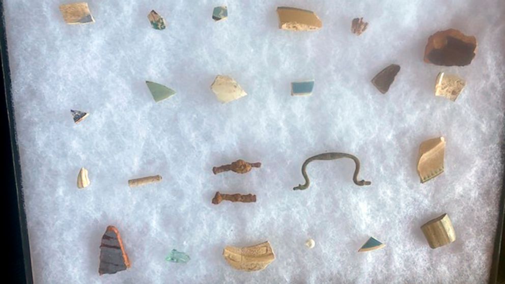 In this image provided by the U.S. Fish and Wildlife Service, items recovered from an archaeological site on Maryland's Eastern Shore that state officials believe to be the home of Harriet Tubman's father, Ben Ross, are displayed in a case, Tuesday, 