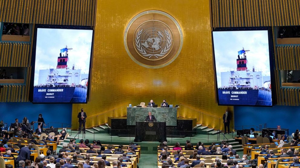 An image of the 'Brave Commander' ship carrying grain from Ukraine is displayed on screens as Secretary-General António Guterres addresses the 77th session of the General Assembly at United Nations headquarters Tuesday, Sept. 20, 2022. (AP Photo/Mary