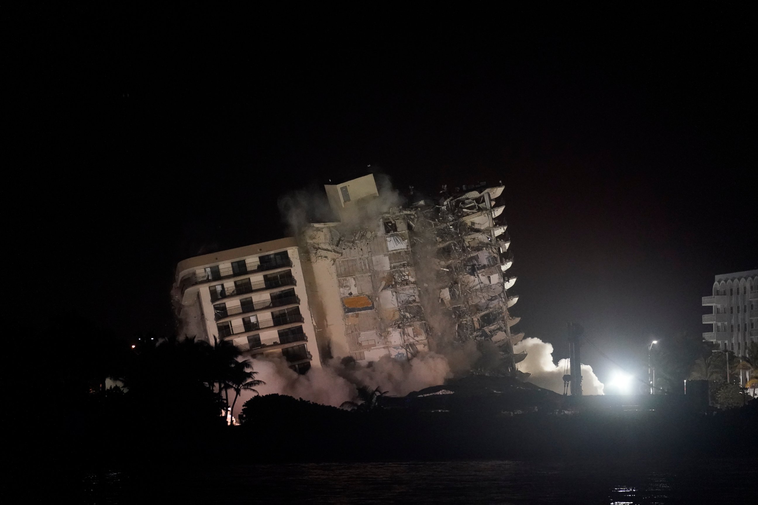 The damaged remaining structure at the Champlain Towers South condo building collapses in a controlled demolition, Sunday, July 4, 2021, in Surfside, Fla. The decision to demolish the Surfside building came after concerns mounted that the damaged str