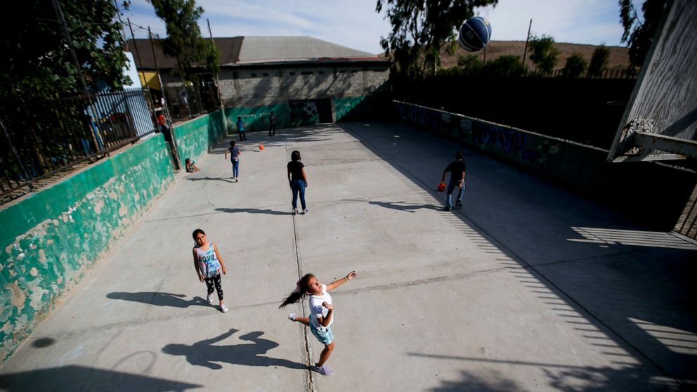 Migrant children play at the Agape World Mission shelter used mostly by Mexican and Central American migrants who are applying for asylum in the U.S., on the border in Tijuana, Mexico, Monday, June 10, 2019. The mechanism that allows the U.S. to send