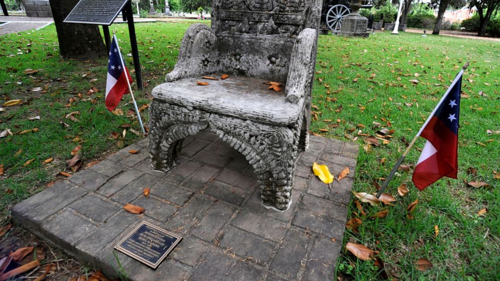 FILE - A monument to Confederate President Jefferson Davis is shown at a cemetery in Selma, Ala., on Wednesday, June 2, 2021. Three people were charged earlier this following the disappearance of the chair, which was recovered in New Orleans and is n