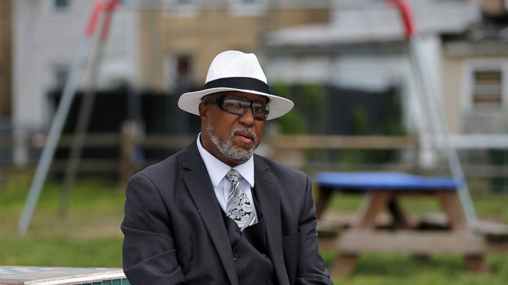 In this Wednesday, April 29, 2020 photo, Marvin L. Cheatham Sr., who led his local NAACP chapter in the 1990s, poses in the park he built in West Baltimore following the riots sparked from the 2015 Freddie Gray arrest. Starting Friday, May 1 nearly t