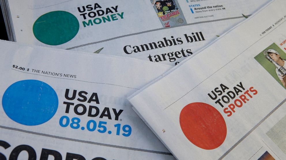 FILE - In this Aug. 5, 2019, file photo, sections of a USA Today newspaper rest together in Norwood, Mass. GateHouse Media has closed on its takeover of Gannett, bringing about 260 daily papers together to become the country’s largest newspaper compa