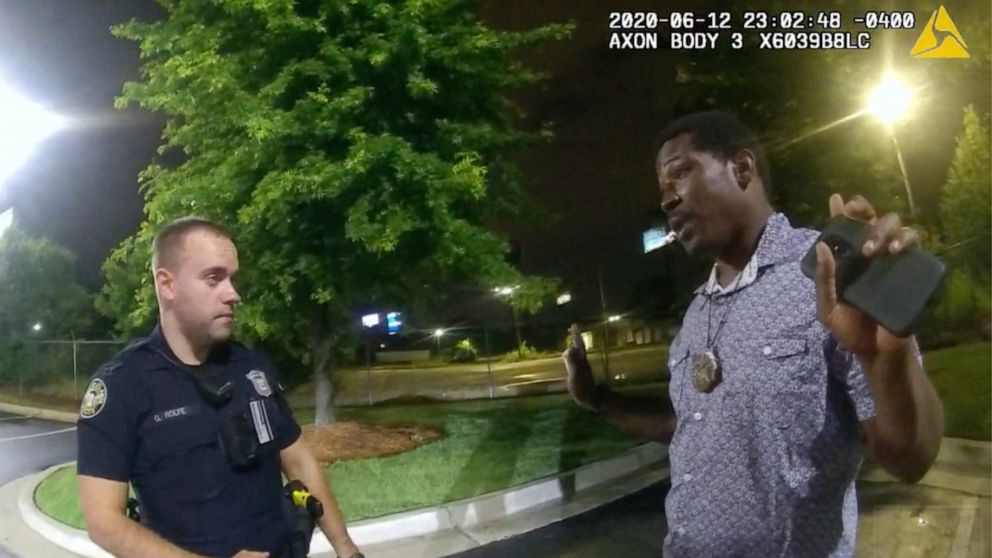 FILE - This screen grab taken from body camera video provided by the Atlanta Police Department shows Rayshard Brooks, right, as he speaks with Officer Garrett Rolfe in the parking lot of a Wendy's restaurant in Atlanta, on June 12, 2020. The Atlanta 