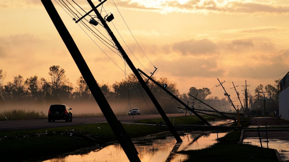 Downed power lines slump over a road in the aftermath of Hurricane Ida, Friday, Sept. 3, 2021, in Reserve, La. (AP Photo/Matt Slocum)
