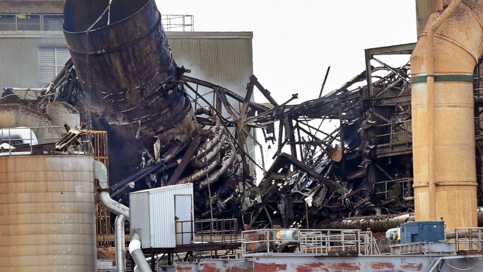 Wreckage smolders at the Androscoggin Mill after an explosion at the paper mill, Wednesday, April 15, 2020, in Jay, Maine. The explosion shook the ground and produced a plume of black smoke that was visible for miles around.(AP Photo/Robert F. Bukaty)