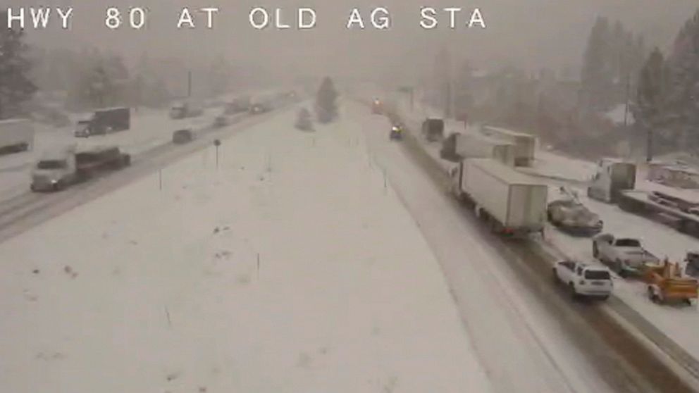 In this image taken from video from a Caltrans remote video traffic camera, traffic moves slowly through the snowy conditions along Interstate 80 near Truckee, Calif., Tuesday, Nov. 8, 2022. A major winter storm pounded California on Tuesday, bringin