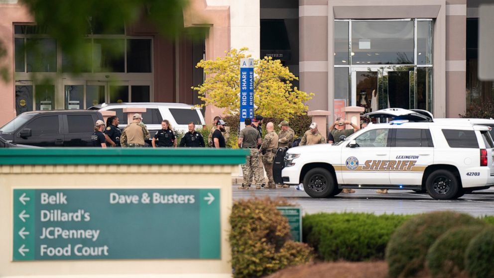 FILE - Members of law enforcement gather outside Columbiana Centre mall in Columbia, S.C., following a shooting, April 16, 2022. Authorities in South Carolina say they are investigating shooting at a club in Hampton County early Sunday, April 17, 202