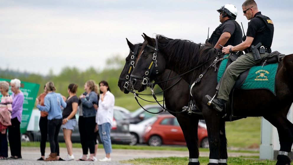 FILE - Officers on horseback guard the entrance to designated demonstrator areas near Riverbend Maximum Security Institution as people wait to enter before the scheduled execution of inmate Oscar Smith on April 21, 2022, in Nashville, Tenn. Tennessee